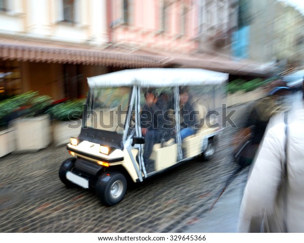 City sightseeing car intended for city tour.\
Intentional motion blur