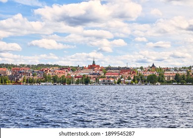 Östersund's City Silhouette Seen From The Island Frösön Where In Between Lies The Lake Storsjön.