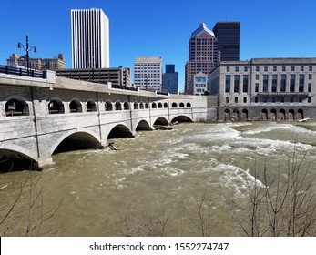 City Skyline And Bridge And Canal Over River In Rochester, NY