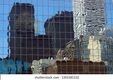 City Skyline Buildings Reflected In A Glass Highrise