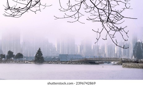 City skyline by water in a foggy morning. Coal Harbour. Vancouver, BC. Canada - Powered by Shutterstock