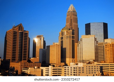 The city skyline of downtown Charlotte, North Carolina refelcts the sunlight on the office buildings and financial centerpiece