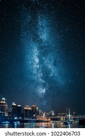 City Skyline At Night With Milky Way On Sky