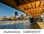 City skyline view over the Allegheny River and Roberto Clemente Bridge in downtown Pittsburgh Pennsylvania USA