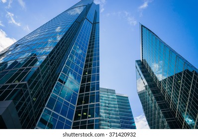 City Skyscrapers at cloudy summer day - Shutterstock ID 371420932