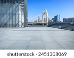 City square and glass wall with modern buildings in Guangzhou