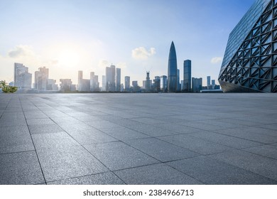 City square and skyline with modern buildings in Shenzhen at sunset, Guangdong Province, China. - Powered by Shutterstock