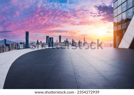 City square and skyline with modern buildings in Shenzhen at sunrise, Guangdong Province, China.