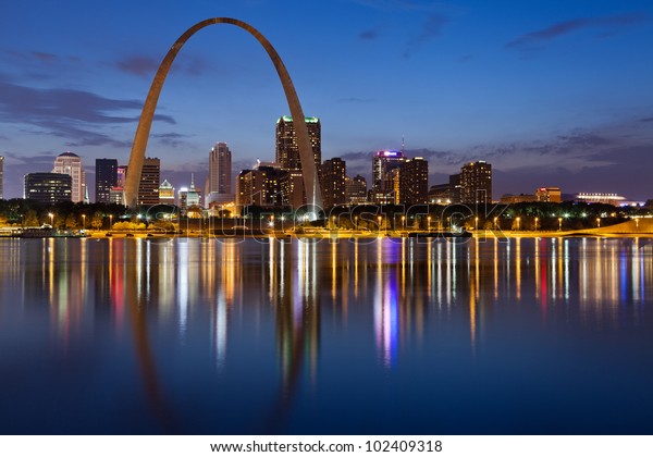 City of St. Louis skyline. Image of St.\
Louis downtown with Gateway Arch at\
twilight.