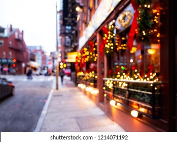 City Street With Christmas Illuminations. Blurred Background. Christmas Lights And Christmas Decorations On The Street