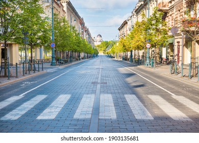 City street with empty crossroad,  road and morning light in Europe, Lithuania, Vilnius