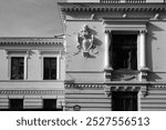 City street and exterior building architecture on the Victory Avenue in Bucharest city, capital of Romania