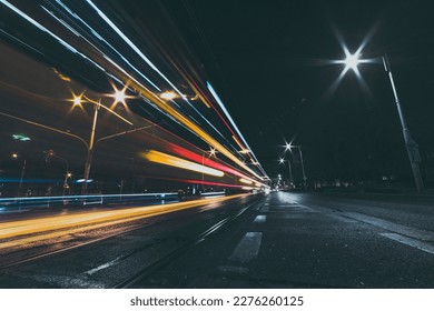 city street at night with vehicle light trails