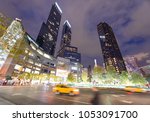 City streets and lights at night near Columbus Circle, New York.