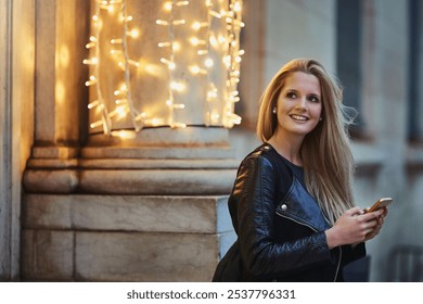 City, thinking and happy woman with smartphone for chat, text message and online request for taxi. Urban, female person and smile with cellphone for digital booking, cab information and wait at night - Powered by Shutterstock