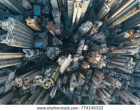 Photo of City Top View of Skyscrapers Building by drone Hong Kong city - Aerial view cityscape flying above Hong Kong City development buildings, energy power infrastructure Financial and business center Asia