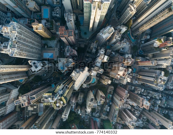 City Top View of Skyscrapers Building by drone Hong\
Kong city - Aerial view cityscape flying above Hong Kong City\
development buildings, energy power infrastructure Financial and\
business center Asia