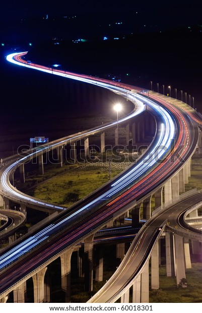 City\
traffic with high way in night in Taiwan,\
Asia.