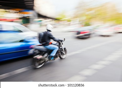 City Traffic With A Motorbike And Cars In Motion Blur