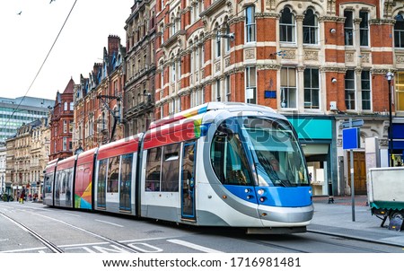 City tram on a street of Birmingham in England