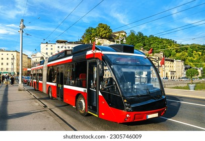 City trolleybus on a bridge across the Salzach in Salzburg, Austria - Powered by Shutterstock