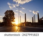 City urban road with sunset behind an old factory. Technopolis, Gazi, Athens, Greece