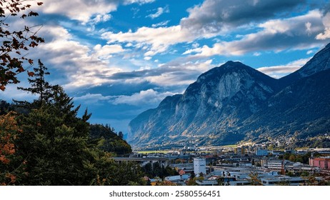 A city in the valley between toweting mountain ranges