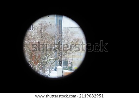 City view from binoculars. Modern festive city in the crosshairs of terrorism, concept
