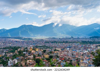 City View Of Kathmandu, Nepal. Colorful Buildings Against The Backdrop Of Mountains