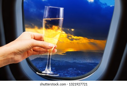 City View From Plane Window With Champagne Glass