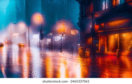 City view through a window on a rainy night,Rain drops on window with road light bokeh, City life in night in rainy season abstract background. Focus on drops on glass - Powered by Shutterstock