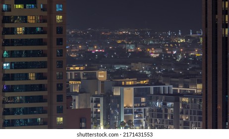 City Walk district aerial night timelapse, new urban area near Dubai downtown. Residential buildings and shopping zone behind skyscraper - Shutterstock ID 2171431553