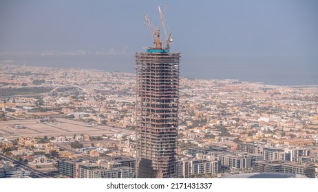 City Walk District With Villas Around Aerial Timelapse In Dubai Downtown. Residential Buildings And Shopping Zone With Construction Site Of New Skyscraper