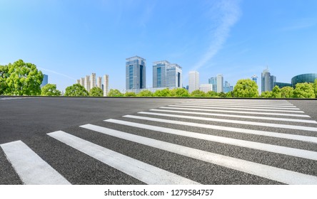 City Zebra Crossing Road And Modern Commercial Buildings In Shanghai