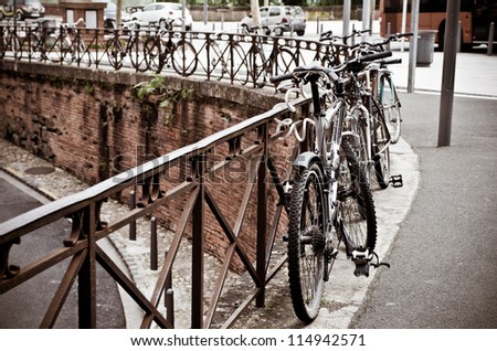 Similar – Fahrräder in der Nähe von niederländischen Häusern in Amsterdam City