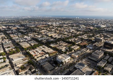 Cityscape aerial view of buildings, homes and streets near Wilshire Blvd in Santa Monica, California.