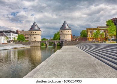 Cityscape with ancient Broel Towers, a classified monument and a landmark in the Belgian city of Kortrijk alongside the Leie river. - Powered by Shutterstock