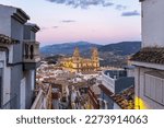 Cityscape of the Andalusian city of Jaen at dusk, with the cathedral to be recognized among the rooftops.