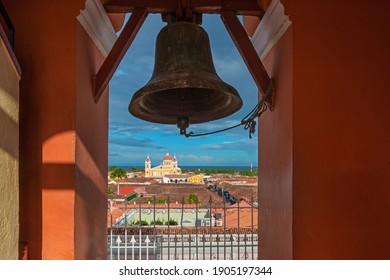 Cityscape from a bell tower with view over the cathedral and Nicaragua Lake, Granada City, Nicaragua.