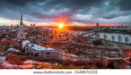 Cityscape of Bratislava, Slovakia with St. Martin's Cathedral and Danube River with New Bridge at Sunrise