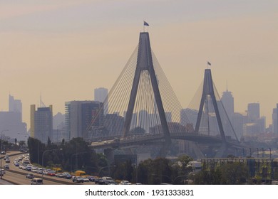 Cityscape Of Bridge And Buildings With Bush Fire Smoke Haze In The City. Sydney Australia	