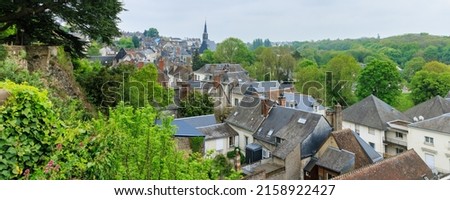 Cityscape of Chateau-Renault with church tower in Loire region in France. View from city hall.