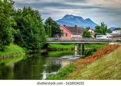 Cityscape of the city of Rosenheim in Bayern in Germany with river Mangfall and Alps mountain in background  