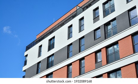 Cityscape with facade of a modern residential building. Modern European residential apartment building.