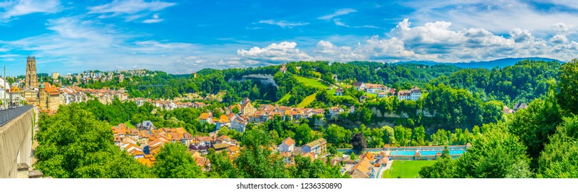 Cityscape of Fribourg dominated by tower of the cathedral of Saint Nicholas, Switzerland - Shutterstock ID 1236350890