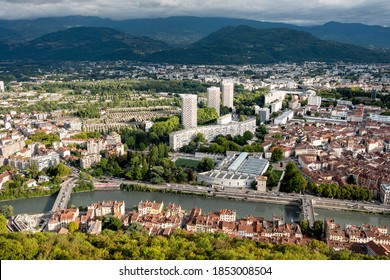 Cityscape Of Grenoble, In The Isère Departement, France. View On High Towers And The Isère River. Cloudy Day.