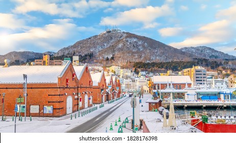 Cityscape of the historic red brick warehouses and Mount Hakodate  at twilight in Hakodate, Hokkaido Japan in winter - Powered by Shutterstock