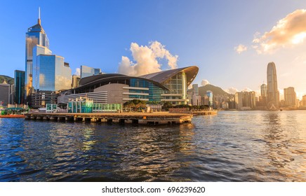 cityscape in Hong Kong with illuminated buildings. Victoria harbour at sunset in Hong Kong