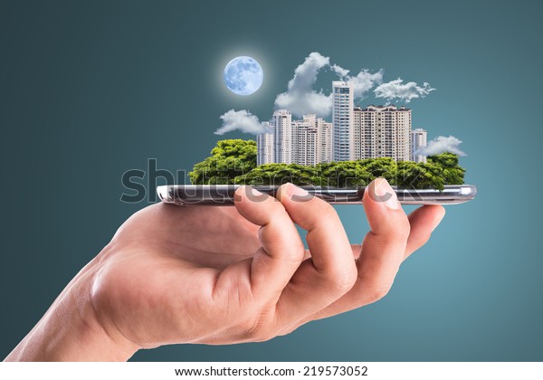 Cityscape intelligent building ,hold smart\
phone for build and make your green\
city.