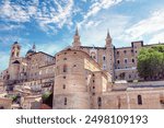 Cityscape of Italian town Urbino with majestic Palazzo Ducale. Palazzo Ducale Castle of the Dukes of Urbino, Italy